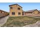 Two story home with drought resistant landscaping in a fenced backyard at 23619 W Harrison Dr, Buckeye, AZ 85326