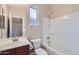 Bathroom featuring a shower over tub and single sink vanity at 23619 W Harrison Dr, Buckeye, AZ 85326