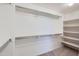 Walk-in closet with carpet flooring and a shelf and rail system for optimal organization at 23619 W Harrison Dr, Buckeye, AZ 85326