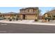 Charming two-story home with desert landscaping and a spacious two-car garage at 23619 W Harrison Dr, Buckeye, AZ 85326