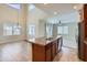 Bright kitchen with an island, stainless steel appliances, and an open layout at 23619 W Harrison Dr, Buckeye, AZ 85326