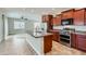 Stylish kitchen with a large center island, stainless steel appliances, and tile flooring at 23619 W Harrison Dr, Buckeye, AZ 85326