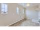 Large laundry room with tile flooring, three windows, and hookups for washer and dryer at 23619 W Harrison Dr, Buckeye, AZ 85326