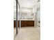 Bright bathroom featuring a double sink vanity, large mirror, and glass-enclosed shower at 24822 S Sedona Dr, Sun Lakes, AZ 85248