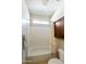 Clean bathroom showcasing a bathtub, toilet, and cabinet storage at 24822 S Sedona Dr, Sun Lakes, AZ 85248