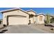 Charming single-story home with neutral stucco and tile roof, complemented by desert landscaping and a two-car garage at 24822 S Sedona Dr, Sun Lakes, AZ 85248