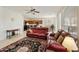 Spacious living room featuring tile floors, ceiling fan, and comfortable seating, seamlessly connected to kitchen at 24822 S Sedona Dr, Sun Lakes, AZ 85248