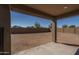 An empty backyard with a cinder block fence, offering privacy and potential at 25930 N Thornhill Dr, Peoria, AZ 85383