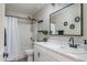 Stylish bathroom featuring a shower-tub combo with a modern single sink vanity at 25930 N Thornhill Dr, Peoria, AZ 85383