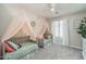 Charming room with twin beds, sheer canopies, soft carpet, and good natural light at 25930 N Thornhill Dr, Peoria, AZ 85383