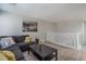 Relaxing loft area with a comfortable sectional sofa and modern decor at 25930 N Thornhill Dr, Peoria, AZ 85383