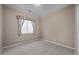 Cozy bedroom features neutral walls, carpet, and a window with blinds at 28604 N 92Nd Pl, Scottsdale, AZ 85262