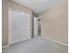 Spacious carpeted bedroom features a large closet with sliding doors for ample storage at 28604 N 92Nd Pl, Scottsdale, AZ 85262