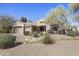 Inviting single-story home with well-maintained desert landscaping and a spacious three-car garage at 28604 N 92Nd Pl, Scottsdale, AZ 85262