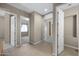 Hallway between rooms with access to carpeted rooms at 28604 N 92Nd Pl, Scottsdale, AZ 85262