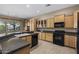 Bright kitchen with tile floors, granite countertops, and lots of cabinet storage space at 28604 N 92Nd Pl, Scottsdale, AZ 85262