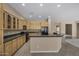 Kitchen featuring tile floors, wood cabinetry, and black appliances at 28604 N 92Nd Pl, Scottsdale, AZ 85262