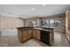 Kitchen featuring lots of cabinet storage space, stone counters, and tile flooring at 28604 N 92Nd Pl, Scottsdale, AZ 85262