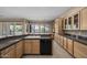 Spacious kitchen with stone counters, tile floors, and wood cabinetry at 28604 N 92Nd Pl, Scottsdale, AZ 85262