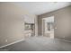 Open living space with multiple entryways, plush carpet, and access to other rooms at 28604 N 92Nd Pl, Scottsdale, AZ 85262