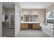 Large main bathroom with double sink vanity, and open access to walk in closet at 28604 N 92Nd Pl, Scottsdale, AZ 85262