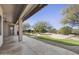 The covered patio offers scenic views of the backyard pool and lush desert plants at 28604 N 92Nd Pl, Scottsdale, AZ 85262