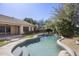 Backyard pool featuring desert landscaping and mature trees at 28604 N 92Nd Pl, Scottsdale, AZ 85262