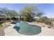Inviting backyard pool surrounded by mature trees and desert landscaping at 28604 N 92Nd Pl, Scottsdale, AZ 85262