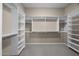 A large, walk-in closet has plenty of shelving and storage at 28604 N 92Nd Pl, Scottsdale, AZ 85262