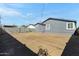 View of the backyard with grey house and cinder block wall at 2927 W Monte Vista Rd, Phoenix, AZ 85009