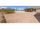 Large backyard with a patio area, desert plants, and additional outdoor storage at 36249 N 7Th St, Phoenix, AZ 85086