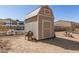 Outdoor storage shed with neutral paint, set on a large lot behind the home at 36249 N 7Th St, Phoenix, AZ 85086