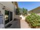 Small outdoor space with brick paver flooring and some bushes at 4003 S Mill Ave, Tempe, AZ 85282