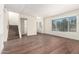 Open-concept living area with stairs, large window, and plenty of natural light at 4003 S Mill Ave, Tempe, AZ 85282