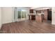 Open living space with sliding glass doors and a kitchen island at 4003 S Mill Ave, Tempe, AZ 85282