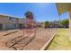 Community playground featuring a red climbing structure and swing set for outdoor fun at 4003 S Mill Ave, Tempe, AZ 85282