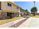 Inviting street view of townhomes with landscaped walkways and mature trees at 4003 S Mill Ave, Tempe, AZ 85282