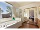 Relaxing bathroom featuring a soaking tub, a separate shower, and natural light at 4245 E Maya Way, Cave Creek, AZ 85331