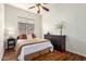 Cozy bedroom with a comfortable bed, a large window, and a dark wood dresser at 4245 E Maya Way, Cave Creek, AZ 85331