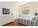 Bright bedroom with hardwood floors, dresser, and a window providing natural light at 4245 E Maya Way, Cave Creek, AZ 85331