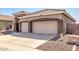 Spacious three-car garage with neutral-colored doors and a large concrete driveway at 4245 E Maya Way, Cave Creek, AZ 85331