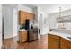 Kitchen features stainless steel refrigerator and wood cabinets at 4245 E Maya Way, Cave Creek, AZ 85331