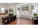 Bright living room area with hardwood floors, bay windows, and stylish furnishings at 4245 E Maya Way, Cave Creek, AZ 85331