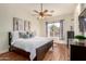Bright bedroom with a ceiling fan, a window, and comfortable furnishings at 4245 E Maya Way, Cave Creek, AZ 85331