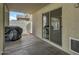 Covered patio with a barbecue grill, sliding glass door, and concrete flooring at 4304 E Whitehall Dr, San Tan Valley, AZ 85140