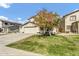 Beautiful two-story home showcasing a well-maintained lawn, mature tree, and convenient three-car garage at 4304 E Whitehall Dr, San Tan Valley, AZ 85140
