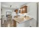 Cozy kitchen boasts wood cabinets and a breakfast bar, perfect for casual dining at 4304 E Whitehall Dr, San Tan Valley, AZ 85140