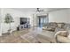 Inviting living room featuring a cozy sectional sofa, decorative rug, and media center at 4304 E Whitehall Dr, San Tan Valley, AZ 85140