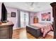 Cozy bedroom with wood floors and lots of natural light at 5141 E Elena Ave, Mesa, AZ 85206