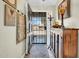 Inviting entryway featuring neutral walls, tile flooring, and an antique wooden cabinet with decorative lamp at 5141 E Elena Ave, Mesa, AZ 85206